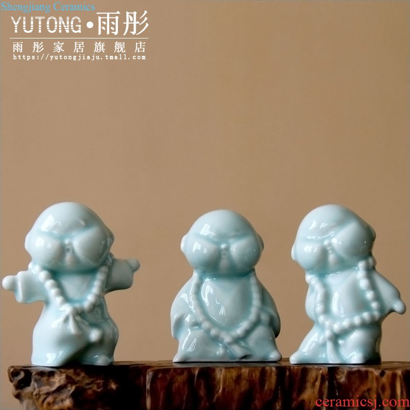 Rain tong home | jingdezhen ceramics creative home hand shadow celadon kung fu boy little monk ceramic furnishing articles