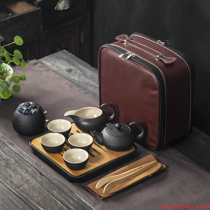 Black pottery travel kung fu tea set to crack a pot of four cups of portable BaoHu outside Japanese household custom logo