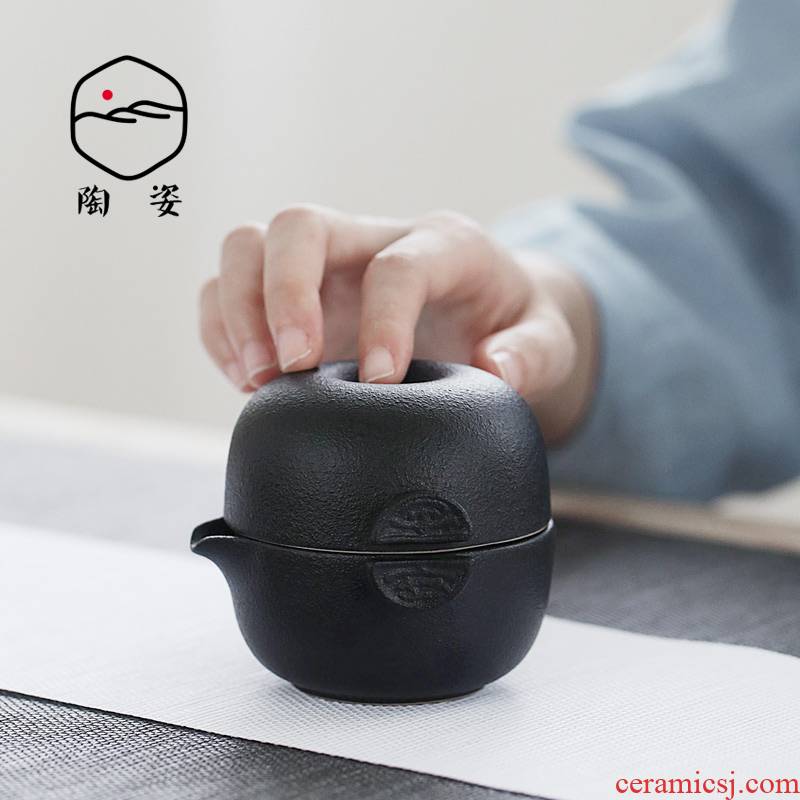 Black pottery cup to crack a pot of a coarse pottery portable travel tea set with kombucha tea the receive bag