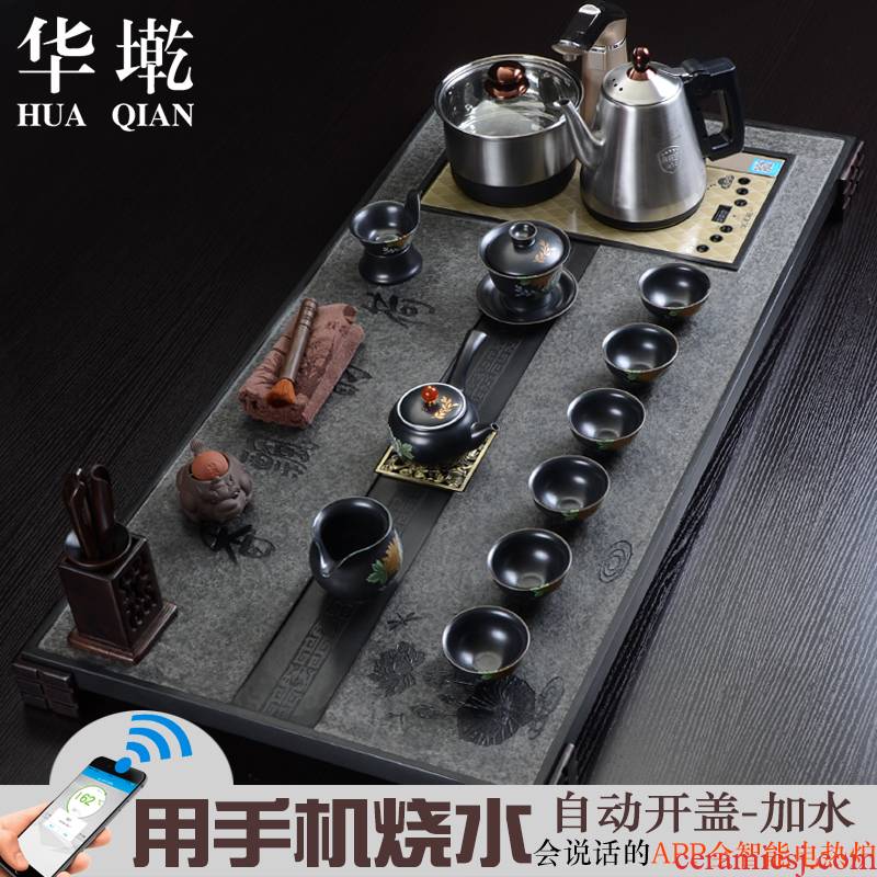 China Qian large sharply black stone tea tray and induction cooker four tea tea sea of a complete set of kung fu tea set