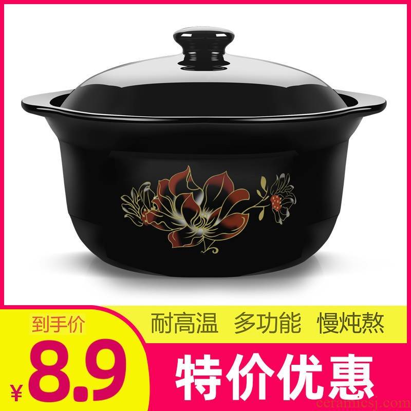 Simmering casserole stew of household ceramics small casserole soup pot gas flame to hold to high temperature crock in clay pot soup