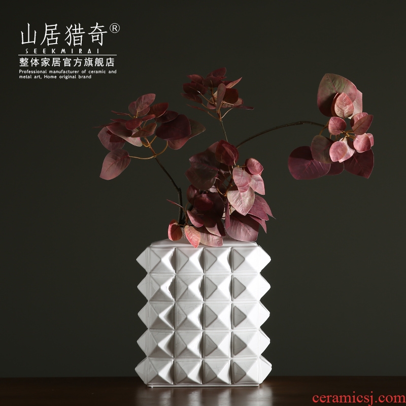 White ceramic flower vases furnishing articles of modern household soft adornment fashion between example sitting room water bottles