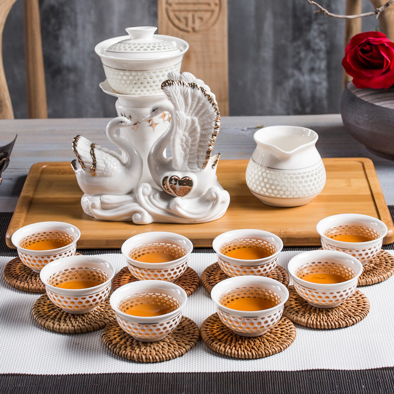 NiuRen exquisite hollow out half automatic ceramic kung fu tea set lazy household tureen tea to implement the hot