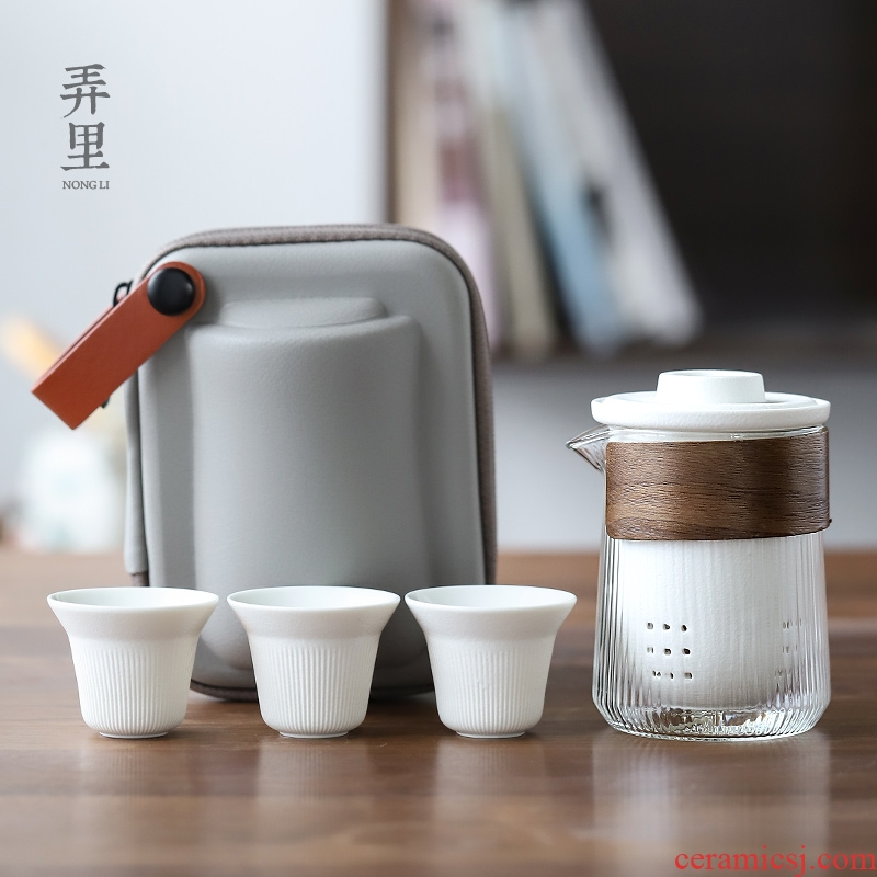 Get in | crack cup portable travel tea set against a pot of three cups of hot ceramics glass kung fu tea set