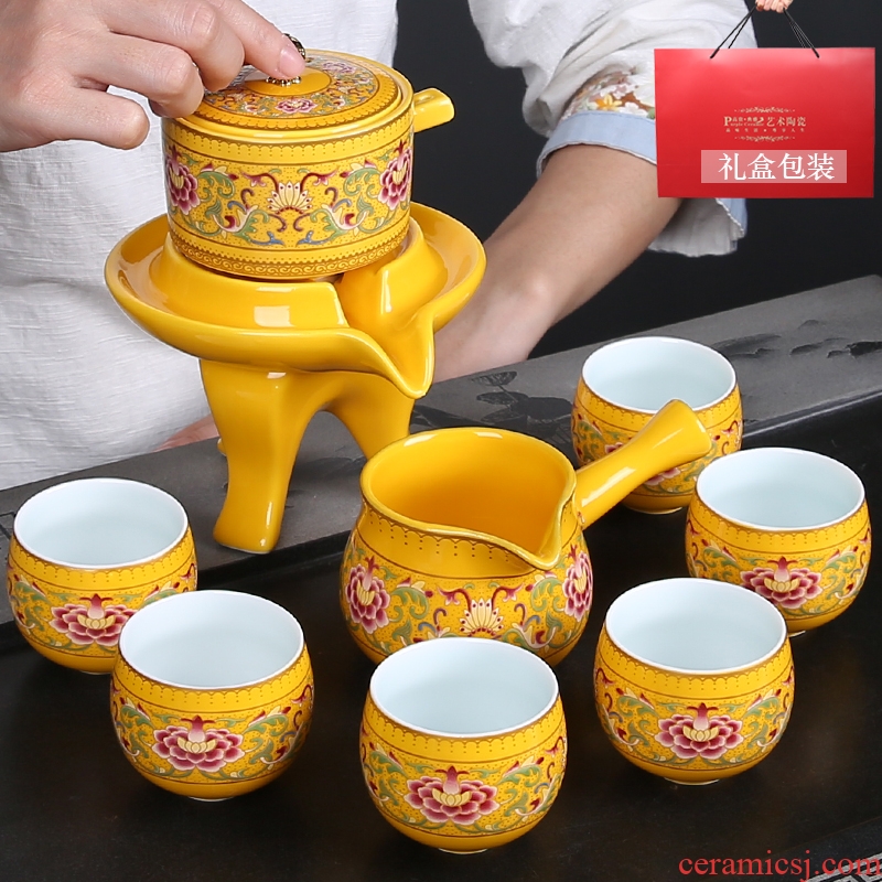 Gold colored enamel of a complete set of automatic tea set lazy hot stone mill ceramics kung fu tea tea gift set is installed