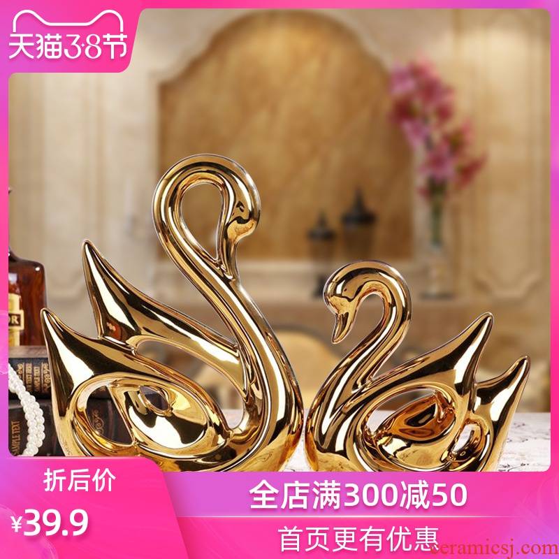 Creative ceramic handicraft wedding gift for the sitting room TV ark, furnishing articles of modern home decoration electroplating swans