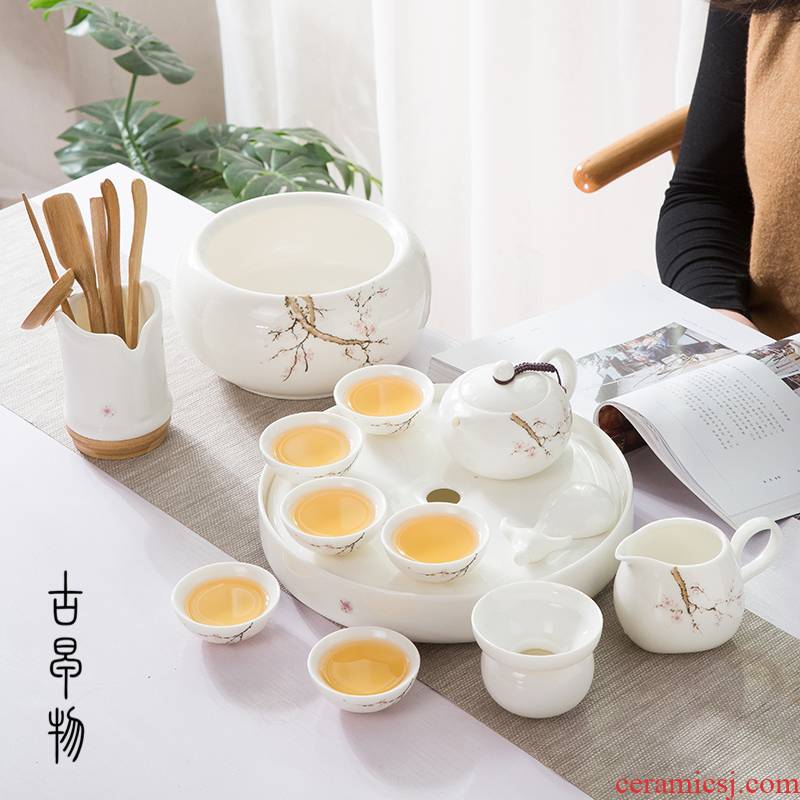 A complete set of dehua white porcelain suet jade suit household green kung fu tea set ceramic tea tray was contracted tea table