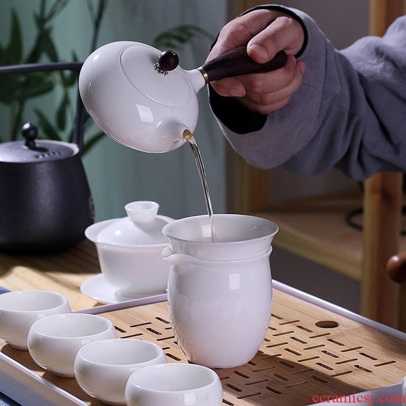 Dehua white porcelain kung fu tea set suit household suet jade cups of a complete set of the tea pot lid to use simple wooden side