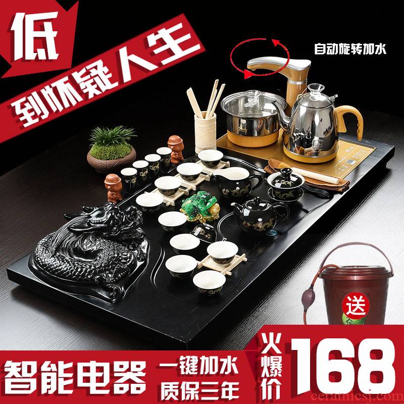 Sun bird automatic four unity of household solid wood tea tray tea set kung fu purple sand pottery and porcelain of a complete set of tea cups