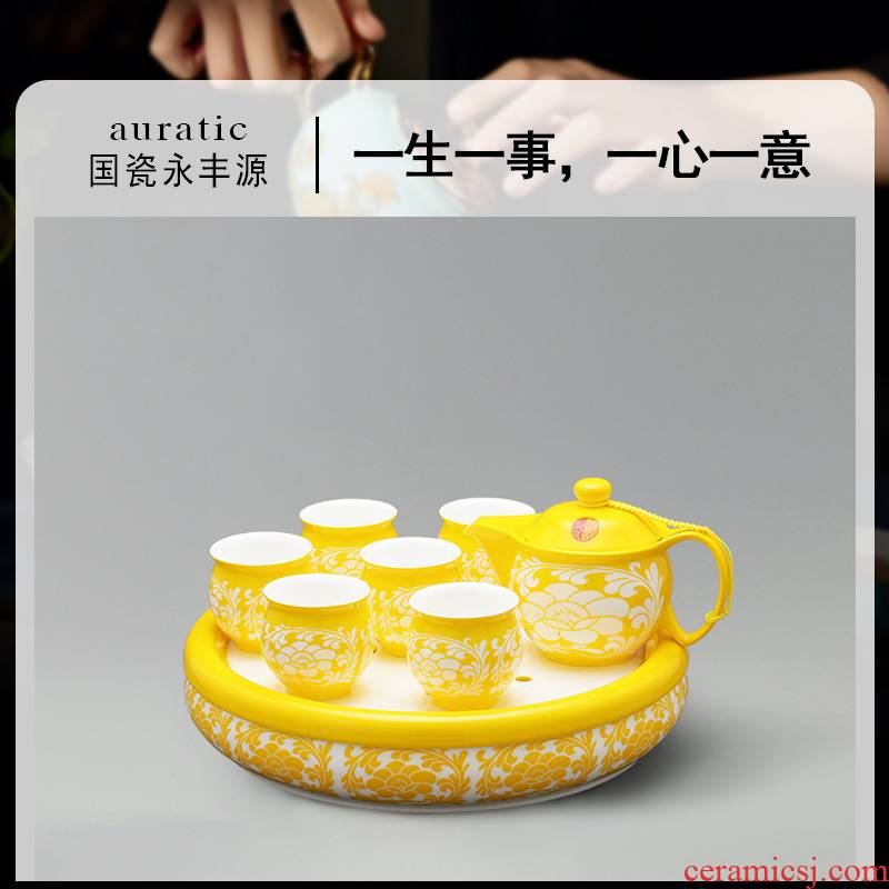 The porcelain yongfeng source under The glaze of carve patterns or designs on woodwork imperial yellow cup teapot tea tray was pu 'er tea of a complete set of suit Chinese wind