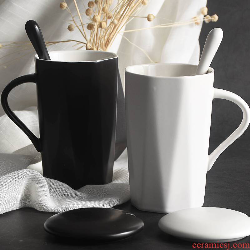 Office ceramic cups individuality creative trend mark cup with cover teaspoons of men 's and women' s household milk ultimately responds. A cup of coffee