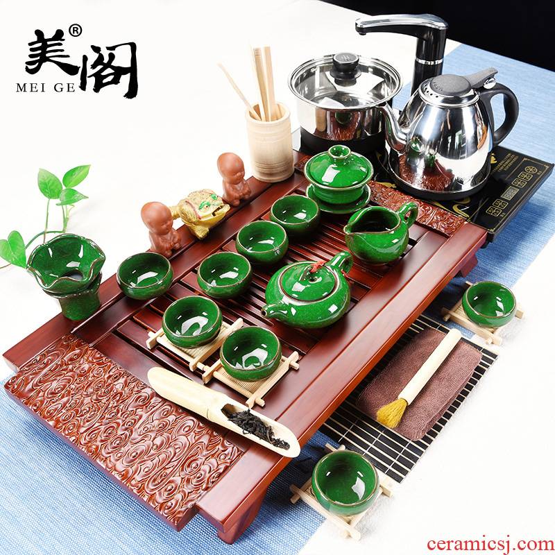 The cabinet of a complete set of ceramic tea set household contracted and I kung fu tea tray was four unity electrothermal furnace tea cups