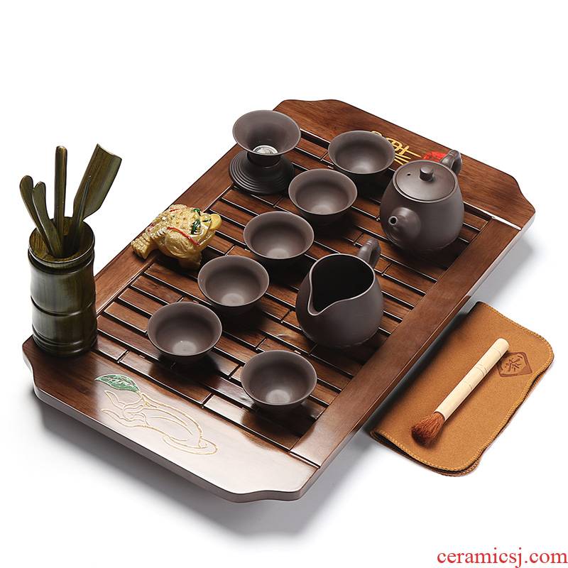 Xin arts edge of a complete set of kung fu tea tea tray was solid wood tea saucer home outfit purple sand tea set