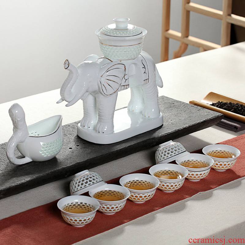 Xin arts edge of a complete set of automatic and exquisite hollow ceramic kung fu tea set suit creative hot lazy teapot