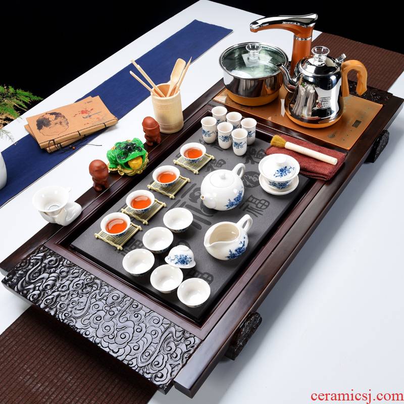 All the popular kung fu home sitting room of a complete set of ceramic tea set automatic household solid wood tea tray tea set