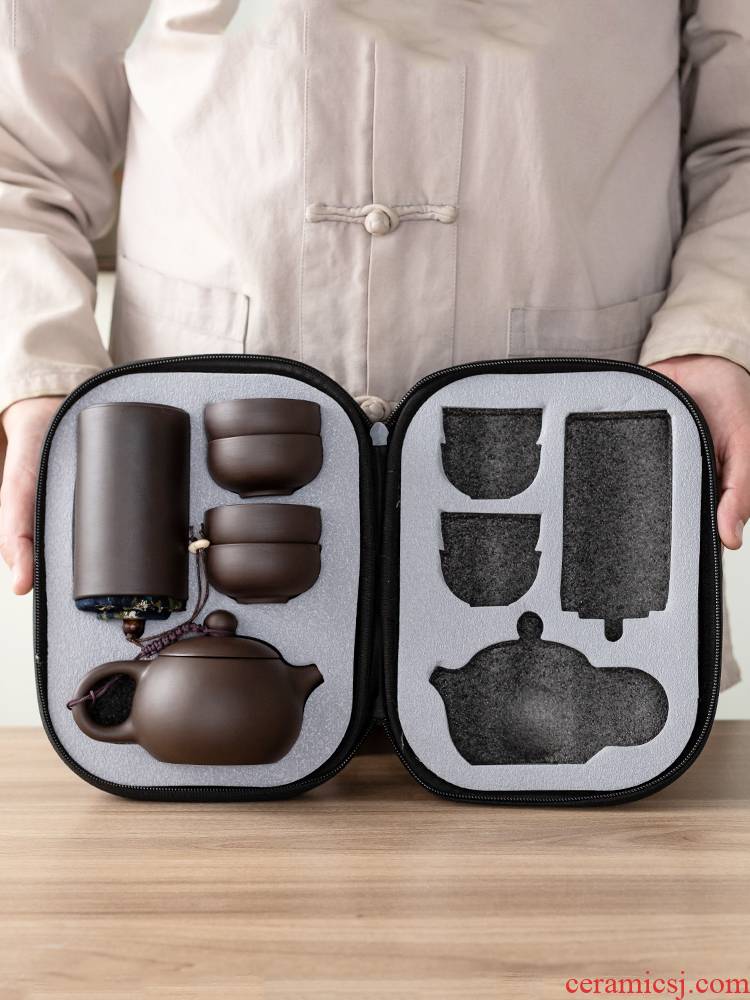 Violet arenaceous a pot of four cups of portable car travel tea set is suing the receive packets contracted to crack a cup of tea tea tray