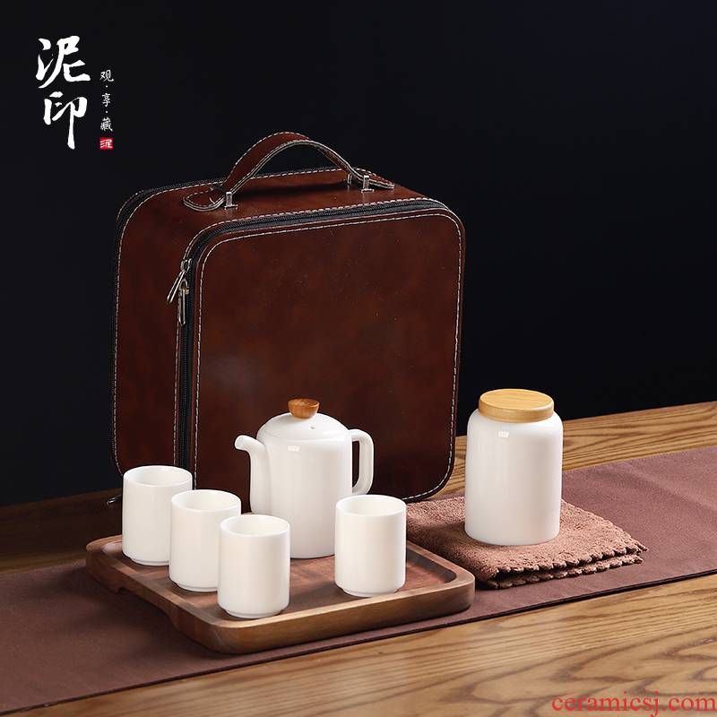 Dehua white porcelain clay seal kung fu tea set suit small household travel set of simplicity suet jade porcelain portable bag