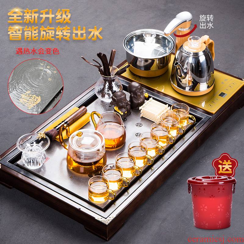 A complete set of glass tea set of household solid wood tea tray was violet arenaceous kettle fully automatic four unity is contracted and I kung fu