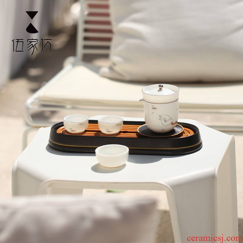 The Wu family travel lane ceramic suit Japanese crack cup creative portable receive small package kung fu tea set home