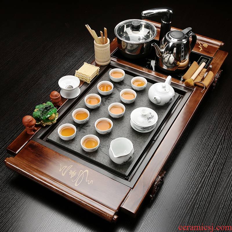The joining together of four solid wood tea set household contracted and I kung fu tea tray celadon ceramic purple ice to crack