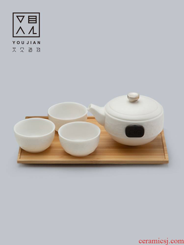 And creation of white porcelain Japanese kung fu tea set a pot of three cups of ceramic teapot teacup office contracted