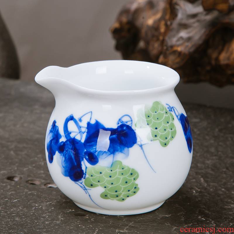 Jingdezhen ceramic fair keller points of blue and white porcelain tea ware hand - made thin foetus male sea tea cup and a cup of tea by hand