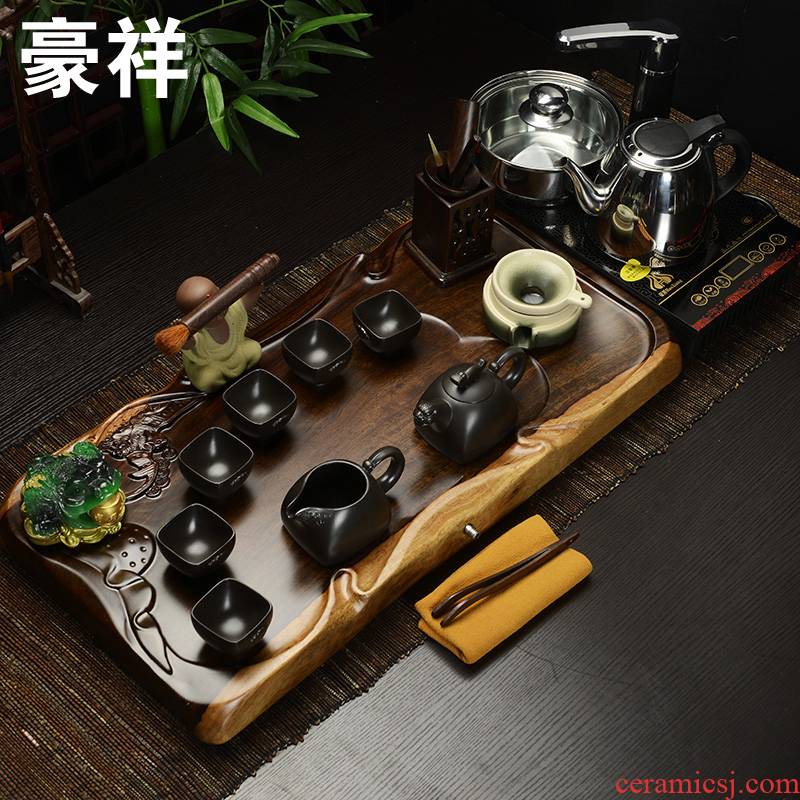 Howe auspicious four unity of the whole piece of ebony wood induction cooker purple sand ground kung fu tea tea service of a complete set of packages