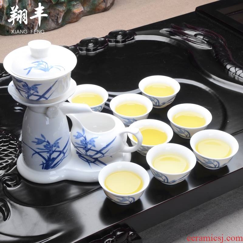 Xiang feng blue and white porcelain tea tieguanyin red ceramic cups of a complete set of semi - automatic creative kung fu tea set
