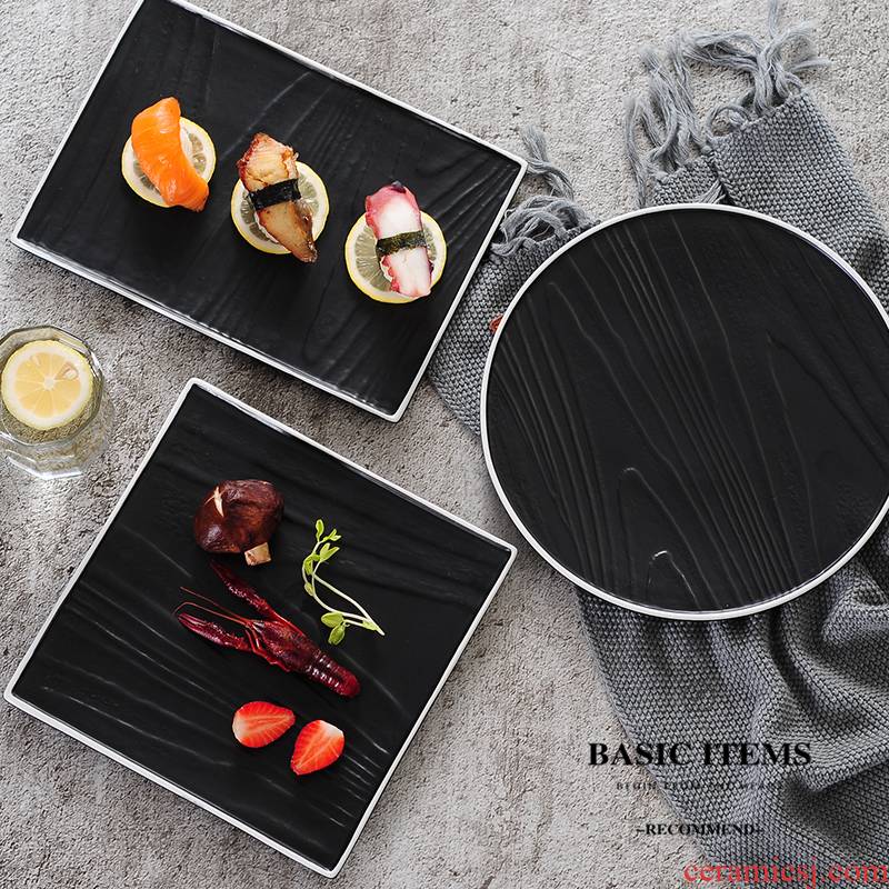 Hotel restaurant ceramic disc beefsteak plate of black wood grain road surroundings while sushi plate plate plate plate