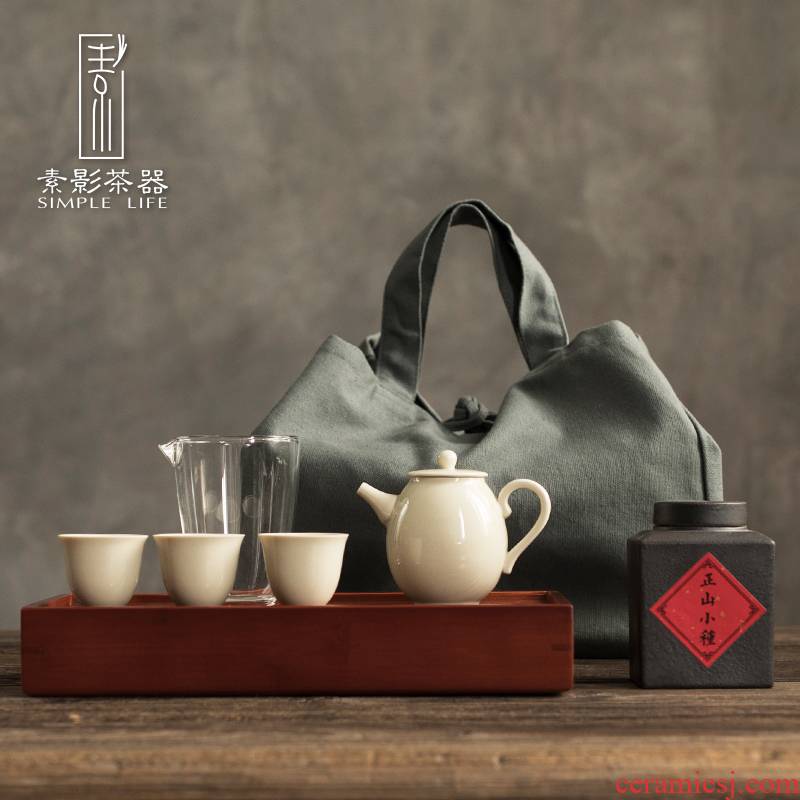 Plain film travel tea set is suing portable bag to receive a pot of three cups of dried bamboo tea tray ceramic teapot
