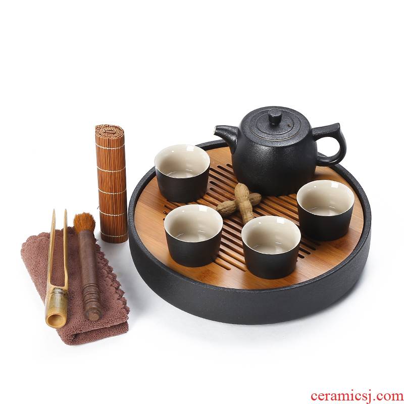 Black pottery tea tray ceramic portable travel bag of a complete set of kung fu tea set suit Japanese household dry teapot teacup