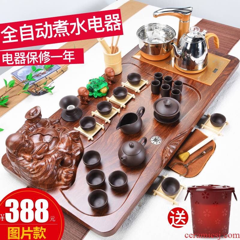 Solid wood tea set the joining together of four domestic tea sets of purple sand cup tea tea tray was contracted Europe type automatic sheung shui