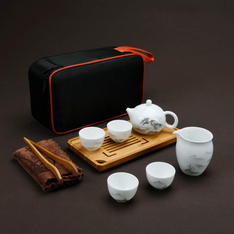 Xu ink white porcelain hand - made travel kung fu tea set household contracted a pot of four cups of tea cup set mini portable package