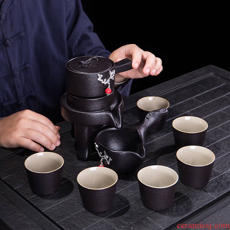Ya xin black pottery tea set automatically with tin name plum flower stone mill lazy people make tea device rotate the effluent of a complete set of the home office