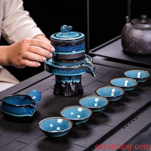 Ya xin purple sand tea set automatically suit family fortunes stone mill rotate the teapot lazy kung fu tea cups