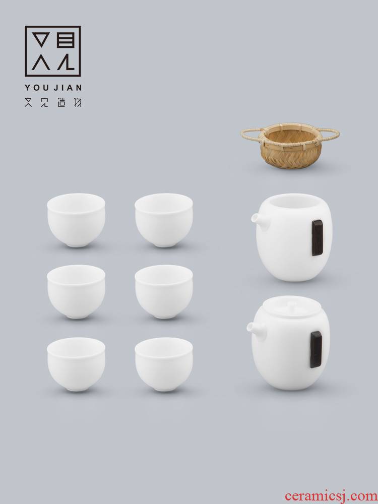 And creation of dehua white porcelain tea tea set suit household contracted hand grasp pot teapot is a complete set of tea cups