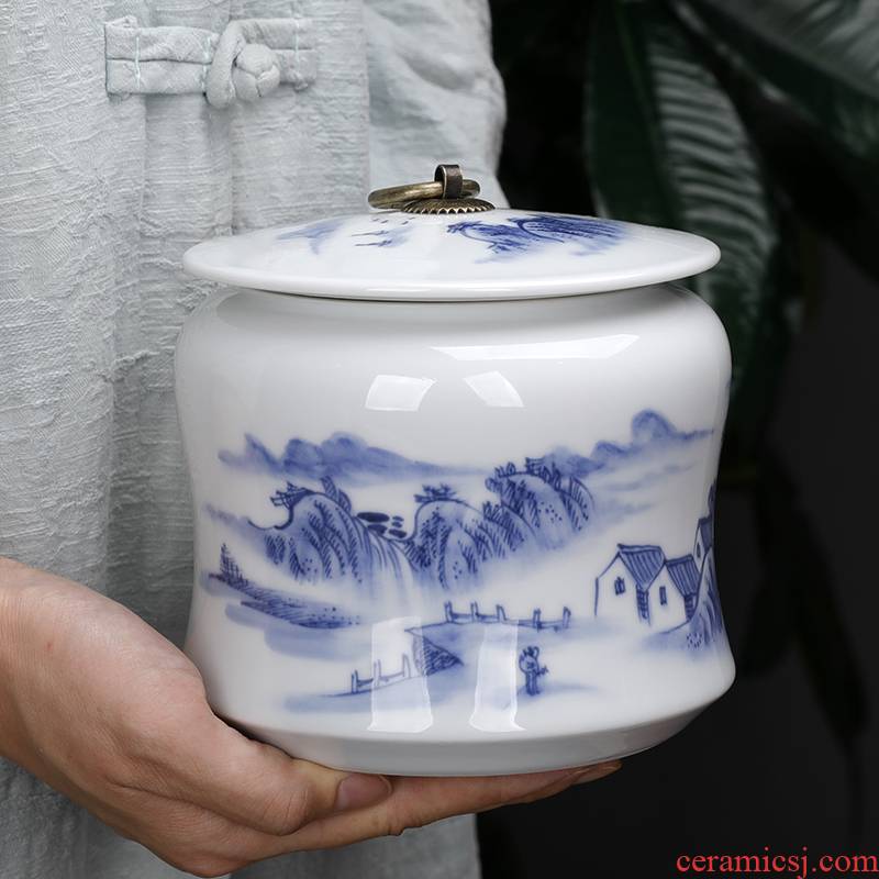 Blue and white landscape small hand - made ceramic pu 'er tea pot half jins of household small seal pot portable portable tea warehouse