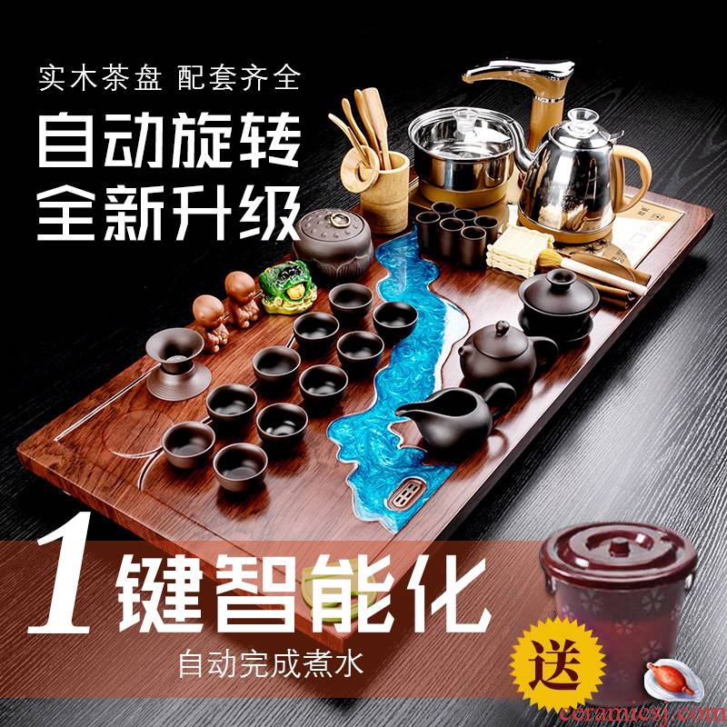 Really sheng kung fu tea with a suit of household ceramic teapot cup of a complete set of automatic solid wood tea tray of tea table