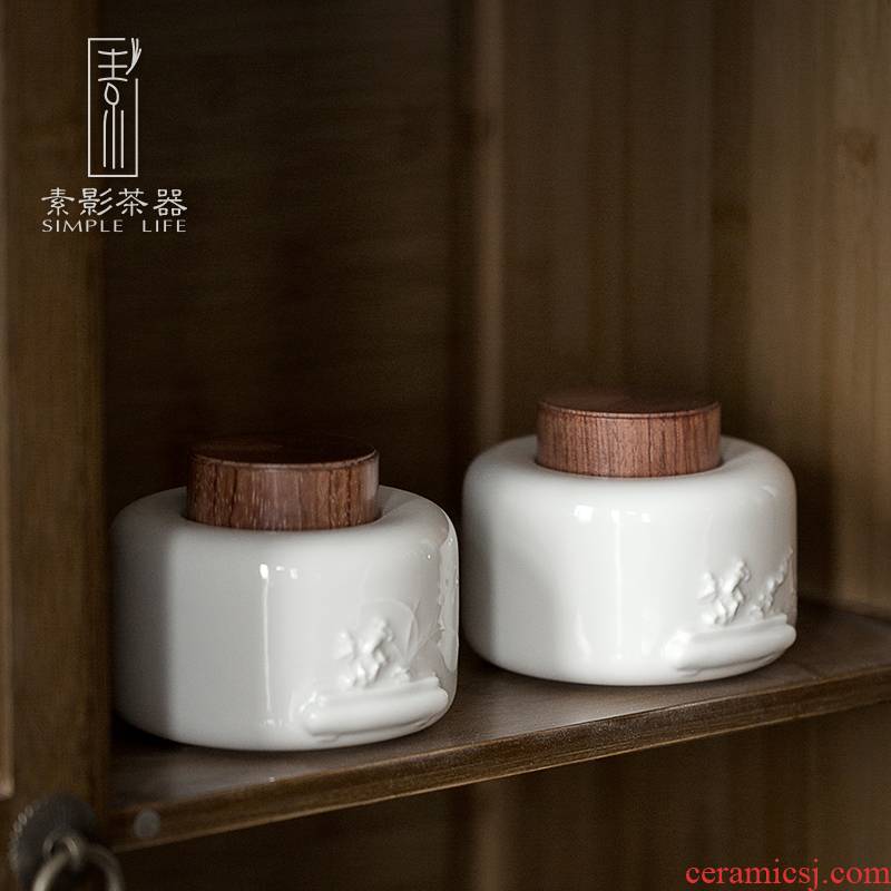 Plain film dehua white porcelain tea pot suet jade porcelain anaglyph ebony cover household ceramic tea storehouse wake tea boxes