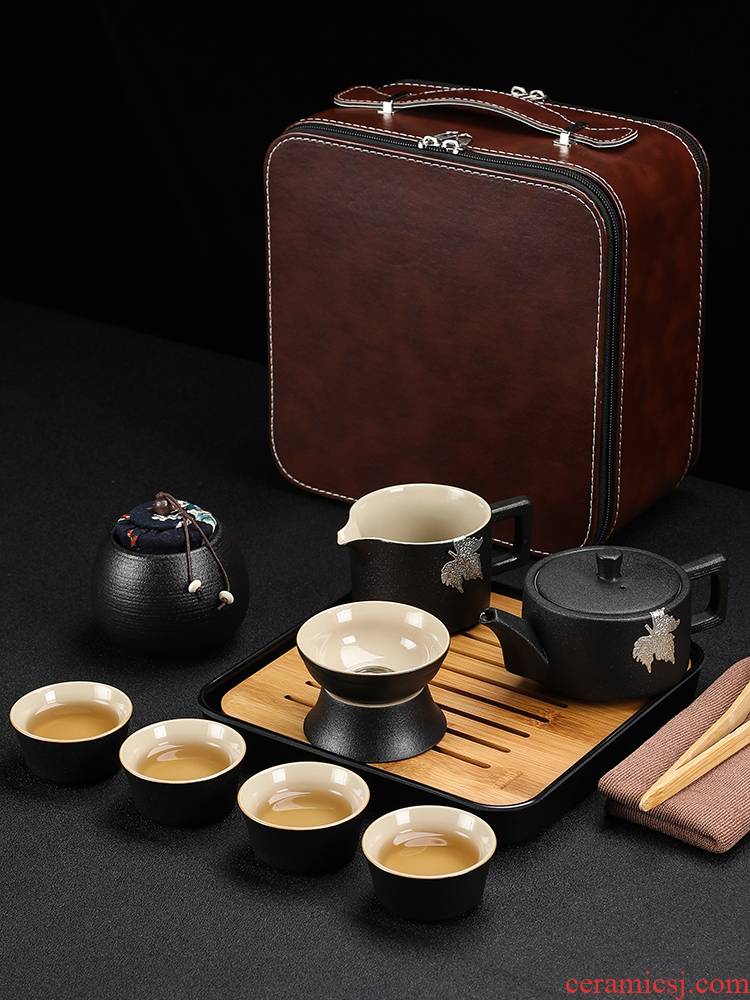 Black pottery travel kung fu tea set to crack a pot of four cups of small portable bag outside Japanese mini household contracted