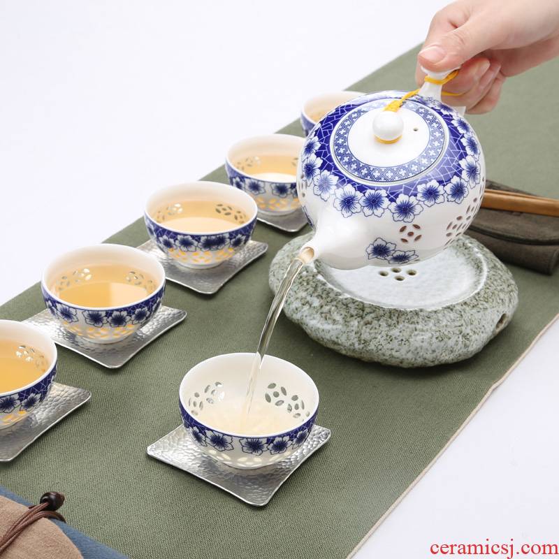 Exquisite hollow out tea set kung fu tea cups of a complete set of ceramic tea tray of blue and white porcelain tea pot