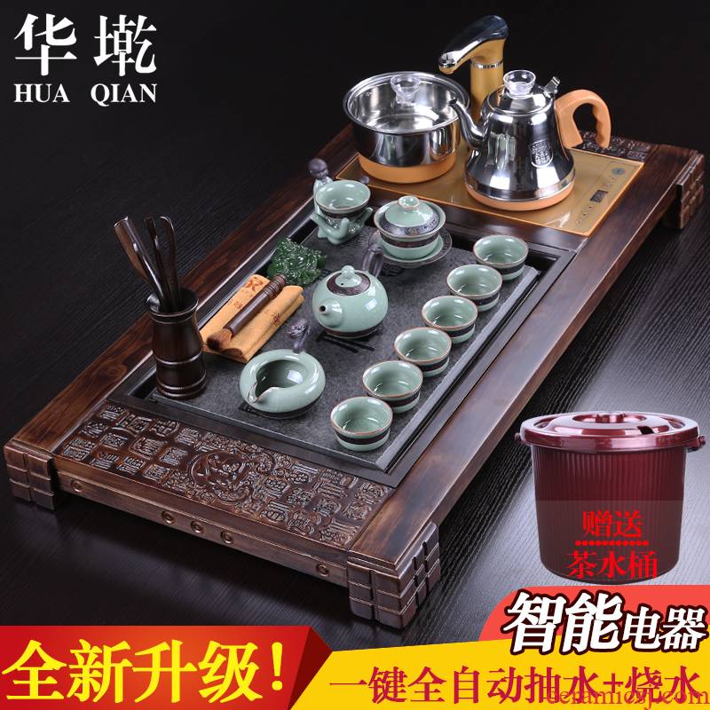China Qian yixing purple sand kung fu tea set tea taking of household solid wood tea tray was four elder brother up and automatic water heating furnace