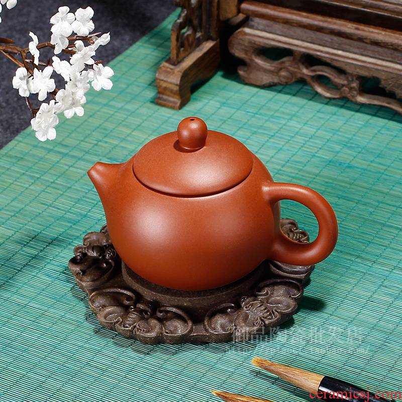 T a pot of purple sand up chunks of tea saucer of mat fills up the teapot mat pot pot bearing base bearing insulation pad the teapot