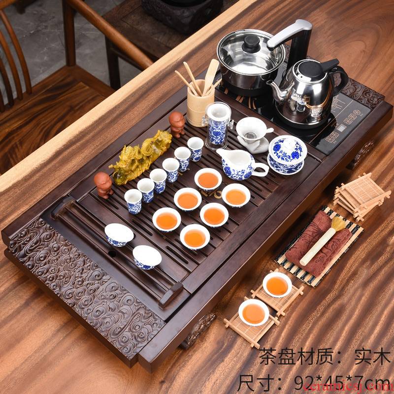 A complete set of violet arenaceous kung fu tea set the teapot tea cups sea household electrical appliances tea accessories solid wood tea tray