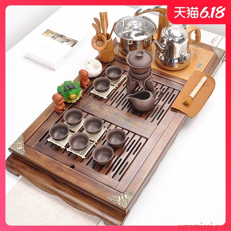 A complete set of automatic tea suit household violet arenaceous kung fu tea set four unity contracted solid wood tea tray was restoring ancient ways