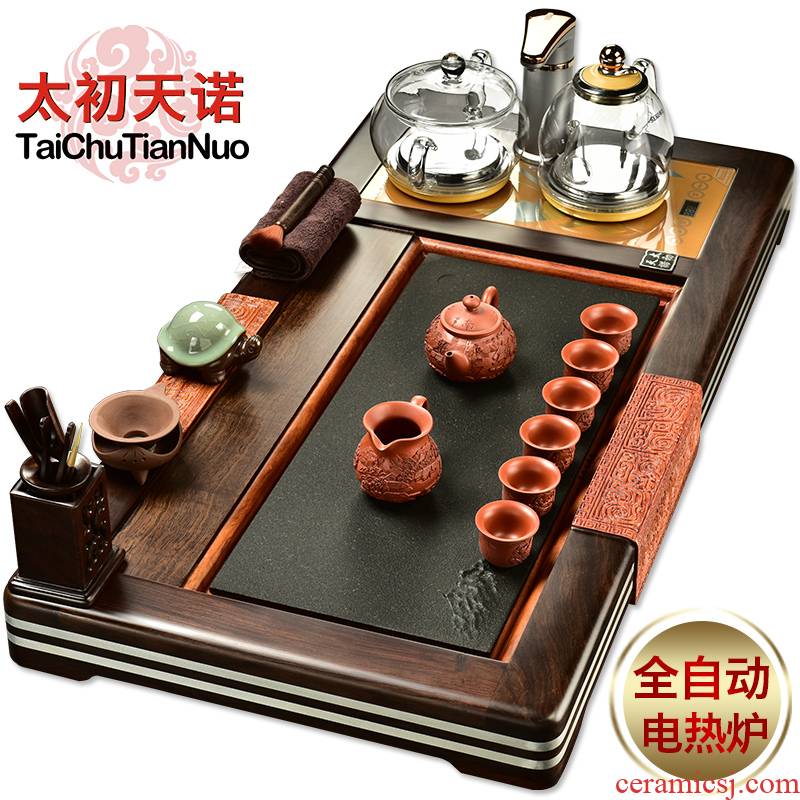 The beginning day, violet arenaceous kung fu tea set four unity of a complete set of automatic sodium silicate on The pot of ebony tea tray
