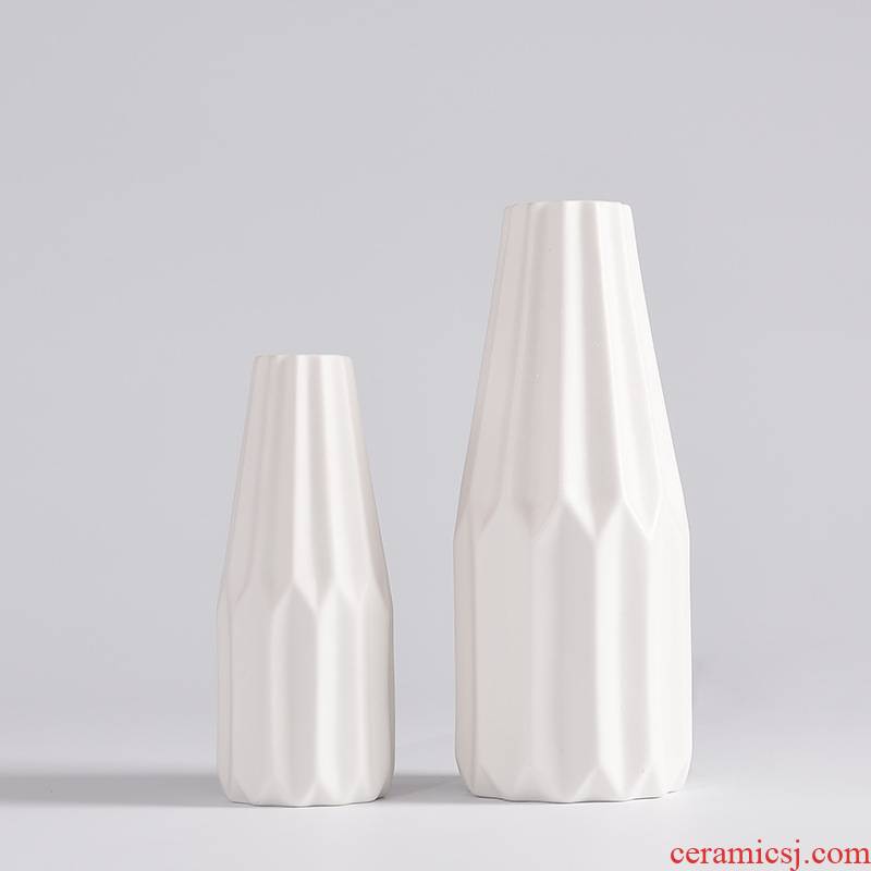 Two modern creative household act the role ofing is tasted furnishing articles contracted white ceramic vases, small and pure and fresh flower arranging flower art to the desktop