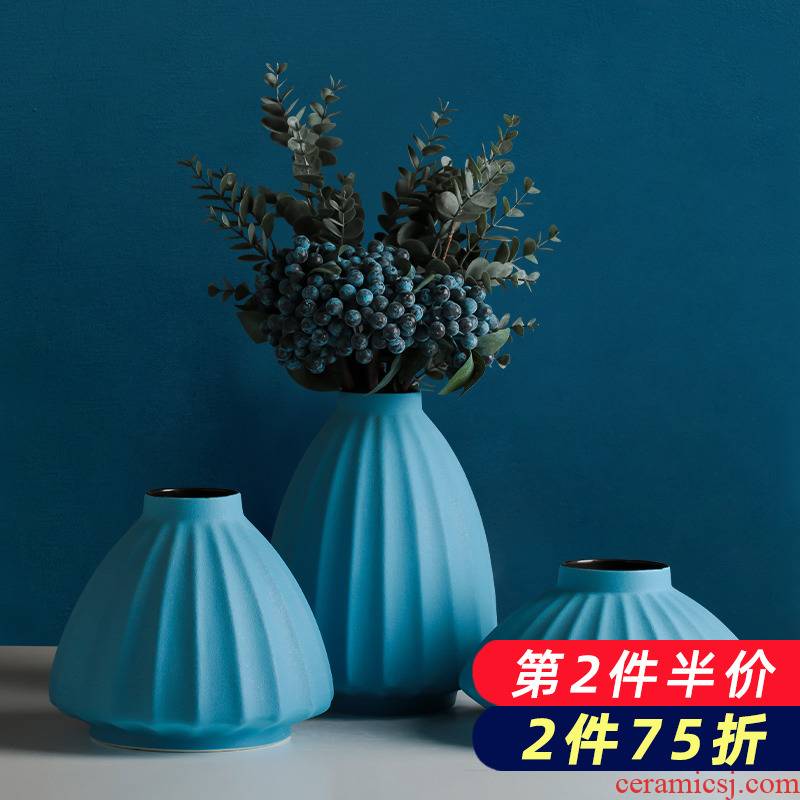 The Nordic creative ceramic blue vase wind dried flowers, contracted and I household flower arrangement table sitting room adornment is placed