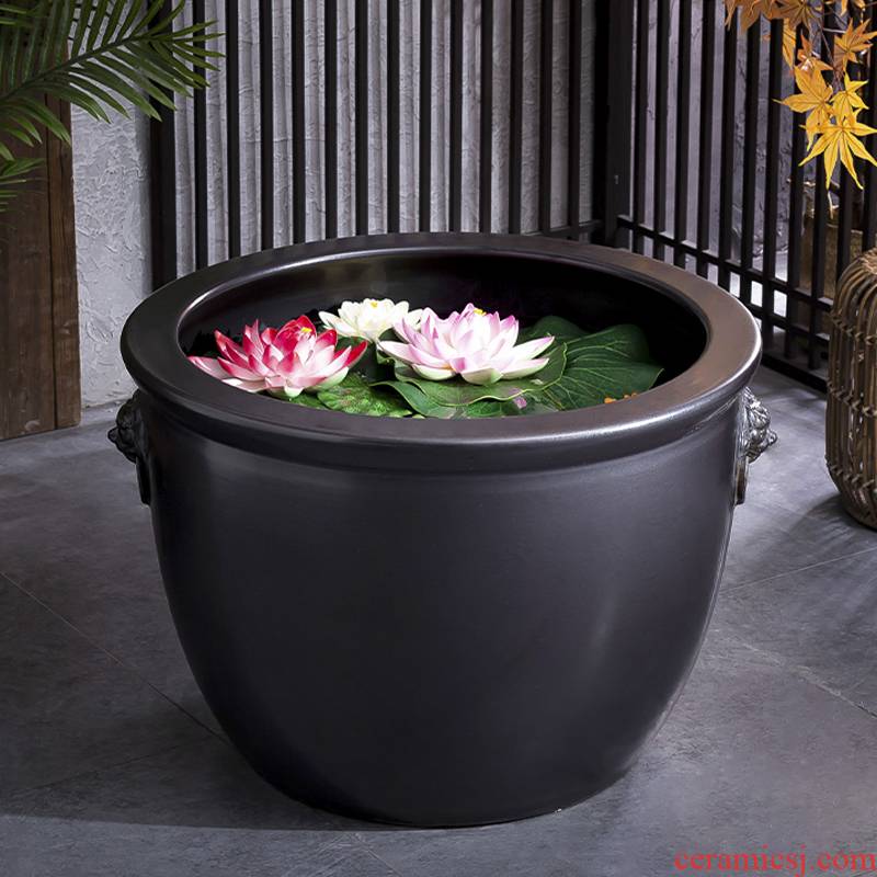 Retro black thick clay ceramic flower pot oversized cylinder circular altar water tanks of large diameter green plant plant trees and flowers POTS courtyard