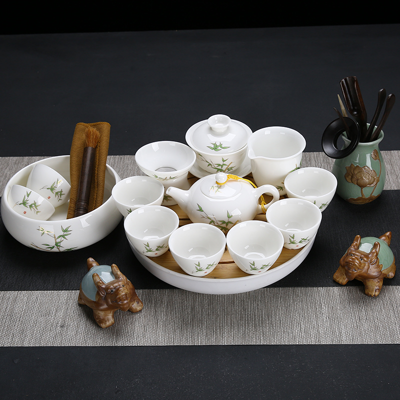 Dehua white porcelain kung fu tea set home office high - quality goods suet jade ceramic lid to use the LOGO